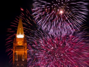 Fireworks explode over the Peace Tower. 
(OTTAWA SUN FILES)