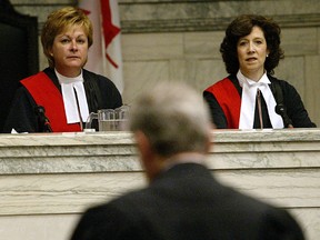 Judge Lori Douglas (left) should quit before anyone has a chance to decide whether to fire her. (WINNIPEG SUN File)