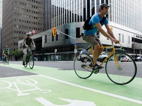 Motorists are being reminded to share the road, after three cyclists were hit by cars in Ottawa on Tuesday morning. (DARREN BROWN/OTTAWA SUN)