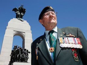 Bill Black, president of the Korean Veterans Association, National Capital Region, is photographed in front of the National War Memorial after a ceremony paying tribute to Korean War Veterans Sunday. (DARREN BROWN/QMI AGENCY
