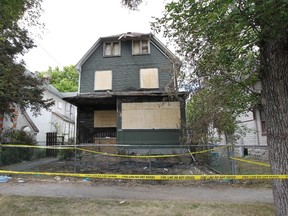 An arson caused the death of five people inside this rooming house on Austin Street in July 2011. (Marcel Cretain, Winnipeg Sun files)