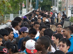 Hundreds of hopeful job seekers for Toronto's CNE job fair in this file photo. (JACK BOLAND/QMi Agency)