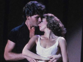 Patrick Swayze, left, and Jennifer Grey are shown in a scene from the 1987 film "Dirty Dancing" in this publicity photo. (Handout)