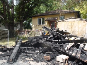A 2011 file photo shows a garage arson in Fort Rouge. ROSS ROMANIUK/Winnipeg Sun files