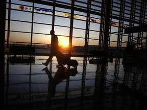 A traveller walks to his flight.(Reuters/Jason Reed)