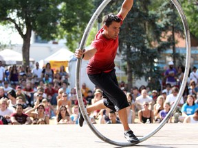 Daniel Craig performs acrobatics as a part of the "street circus" during the final day of the Edmonton Fringe Festival in Edmonton, AB on August 21, 2011. (LAURA PEDERSEN/EDMONTON SUN)