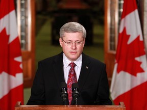 Prime Minister Stephen Harper talks to the media, in the foyer of the House of Commons on Parliament Hill in Ottawa, August 22, 201.   (JOHN MAJOR/QMI AGENCY)