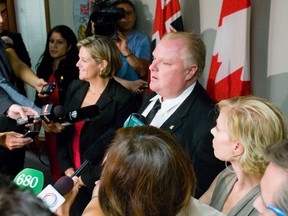 Mayor Rob Ford and NDP leader Andrea Horwath are seen speaking to reporters in this September 2011 file photo. (Toronto Sun files)