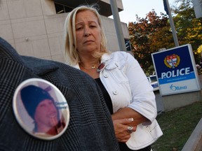 Linda Beland stands outside the Ottawa Police Department Wednesday Oct 5, 2011, after a meeting with Ottawa Police Wednesday to ask that a reward be offered for information leading to an arrest in her son's murder. Douglas Stewart was beaten to death in his Donald St. apartment Feb. 18, 2004.  (Tony Caldwell/Ottawa Sun))