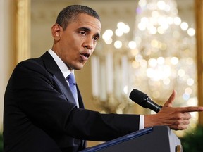 U.S. President Barack Obama gestures during a news conference at the White House in Washington, October 6, 2011.   REUTERS/Jason Reed