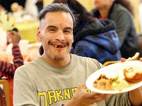 Brian Martin was among the more than 800 who ate Thanksgiving dinner at Siloam Mission Monday. The soup kitchen saw a 15% increase over last year. (BRIAN DONOGH/Winnipeg Sun)