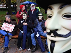 Members of Occupy Ottawa took to the streets after the start of the fall session of the House of Commons. A new proposed law will make wearing masks at some protests a crime. File photo/Tony Caldwell/Ottawa Sun