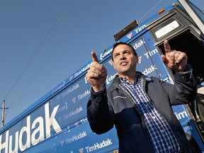 Ontario Progressive Conservative party leader Tim Hudak gestures to campaign workers and supporters of Brant riding candidate Michael St. Amant, at the conclusion of a brief stop in Brantford, Ontario on Wednesday, October 5, 2011. (Brian Thompson/QMI Agency)