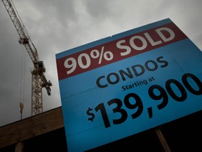 A sign for a condominium development still in the early stages of construction at the corner of Kent St. and Gladstone Ave. reads it's 90% sold. (Darren Brown/Ottawa Sun)