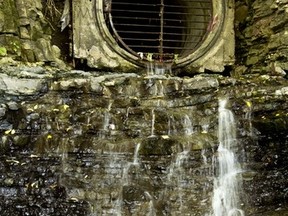 Massive sewage pipe flowing into the Ottawa River in behind the Supreme Court of Canada.