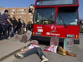 Carleton University students protest the proposed U-pass price hike on campus in this 2012 photo. OC Transpo is now proposing a summer semester u-pass.
(ERROL MCGIHON/THE OTTAWA SUN/QMI AGENCY)