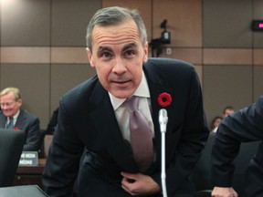 Governor of the Bank of Canada Mark Carney talks to members of the media during a press conference in Ottawa, November 1, 2011. (ANDRE FORGET/QMI Agency)