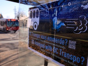 A sign saying "Annoyed with OC Transpo?" with the mayor's Twitter address was posted at a bus shelter on Smyth Rd. Tuesday  Tony Caldwell/Ottawa Sun