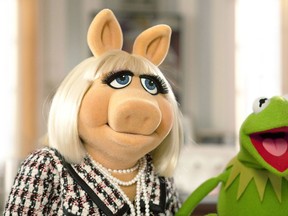 Miss Piggy and Kermit the Frog in a scene from The Muppets. (Handout)