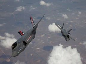 Two F-35 Lightning IIs, also known as the Joint Strike Fighter (JSF), arrive at Edwards Air Force Base in California in this May 2010 file photo. (REUTERS/Tom Reynolds/Lockheed Martin Corp)