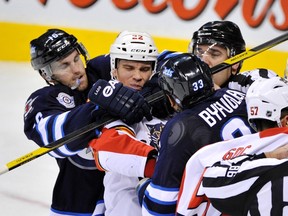 Andrew Ladd (left) and the rest of the Jets are hoping to defend their home turf — and make gains on the road.