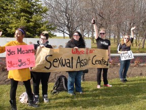 (Left to right) Kandace Price, Dillon Black, Nora Faisal, Julie Lalonde, Sarah McCue were demonstrating at the corner of Sunnyside and Bronson avenues this past fall to protest the fact that Carleton University still doesn't have a sexual assault crisis centre. On Wednesday, Jan. 4, 2012 Carleton announced plans to open one.
(LARISSA CAHUTE/OTTAWA SUN)