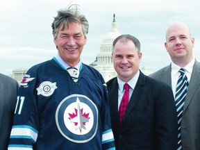 Canadian Ambassador to the United States Gary Doer (left) poses for a photo with Sun hockey writer Ken Wiebe (centre) and Brian Munz, the voice of the Jets on TSN 1290. Reporters were invited to visit the Canadian embassy before Wednesday’s game.