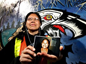 Audrey Auger-Keyesapamotoa holds a photo of her daughter Aielah.