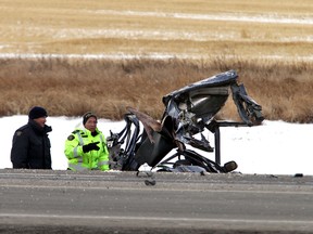 Mounties investigate a crash on Highway 625, Nov. 26, 2011. A car three young men were travelling in was hit from behind by a speeding Dodge Ram on Highway 625 near Beaumont. The force of the impact left the three young men dead at the scene. PERRY MAH/EDMONTON SUN FILE