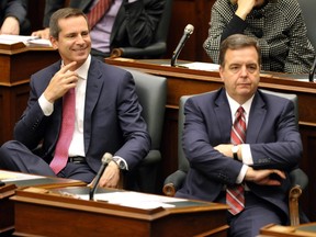Premier Dalton McGuinty and Minister of Finance Dwight Duncan, right, listen to Lt.-Gov. David Onley deliver the throne speech at Queen's Park on Nov. 22, 2011.  (REUTERS/Mike Cassese)