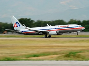 An American Airlines Boeing 737-800 jet touches down at the airport in Port-au-Prince in this February 19, 2010 file photo.    REUTERS/U.S. Navy/Oscar Sosa/Handout