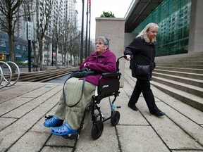 Gloria Taylor, left, is seen with her sister Patty Ferguson outside of the B.C Supreme Court, where she is testifying to challenge the law regarding assisted-suicide in Vancouver, British Columbia December 1, 2011. (REUTERS/Ben Nelms)