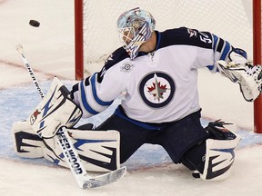 Winnipeg goaltender Chris Mason makes a save on a shot by the Carolina Hurricanes Nov. 25, 2011. (REUTERS)