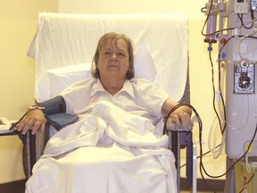 A woman receives dialysis at a Canadian hospital. In Manitoba, her wait for treatment could be weeks longer than in Ontario. (QMI Agency files)
