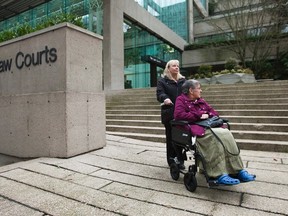 Gloria Taylor (L) is seen with her sister Patty Ferguson outside of the B.C Supreme Court, where she is testifying to challenge the law regarding assisted-suicide, in Vancouver, B.C. Gloria Taylor suffers from Lou Gehrig's disease and is trying to change B.C's medically assisted suicide law. (REUTERS/Ben Nelms)