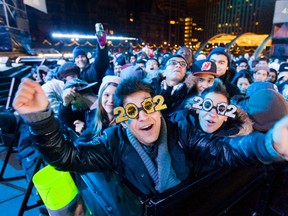 When the clock finally struck midnight in Toronto, party goers cheered, hugged, kissed sweethearts and sang Auld Lang Syne, many of them with their arms linked together (ERNEST DOROSZUK/Toronto Sun).