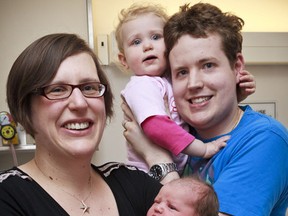 The first baby born in Ottawa in 2012 was Audrey Pelchat, daughter to Sarah Fairbrass and Matt Pelchat and little sister to 2 year old Violet. The family posed for a photo at the Civic Campus of the Ottawa Hospital. Sunday January 1,2012. 
(ERROL MCGIHON/OTTAWA SUN)