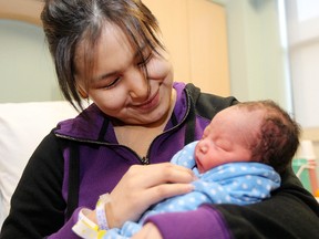 Anne Rose Aulatjut of Arviat, Nunavut, kisses her son Noah Ishalook in Winnipeg Sunday January 01, 2012. Noah weighed 6 lbs 7 oz at birth.
BRIAN DONOGH/WINNIPEG SUN/QMI AGENCY
