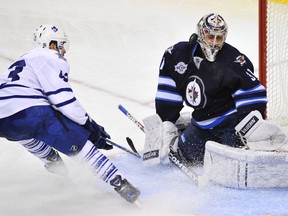 Pavelec makes a save on Leafs Nazem Kadri during the third period on Saturday. Great goaltending was one of the many things Jets got right in December but January’s ‘the tough month.’ (FRED GREENSLADE/Reuters)