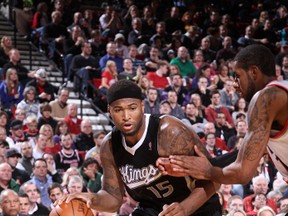 Sacramento Kings DeMarcus Cousins, left, drives against Portland Trail Blazers LaMarcus Aldridge during the game on December 27, 2011 at the Rose Garden Arena in Portland, Oregon. (Sam Forencich/NBAE via Getty Images/AFP)