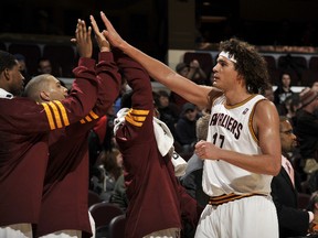 Cleveland Cavaliers Anderson Varejao receives high fives from his teammates after coming out of the game with a large lead late against the New Jersey Nets at The Quicken Loans Arena on January 1, 2012 in Cleveland, Ohio. (David Liam Kyle/NBAE via Getty Images/AFP)