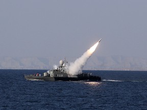 A new medium-range missile is fired from a naval ship during Velayat-90 war game on Sea of Oman near the Strait of Hormuz in southern Iran January 1, 2012. Iran test-fired a new medium-range missile, designed to evade radars, on Sunday during the last days of its naval drill in the Gulf, the official IRNA news agency quoted a military official as saying. (REUTERS/Jamejamonline/Ebrahim Norouzi)
