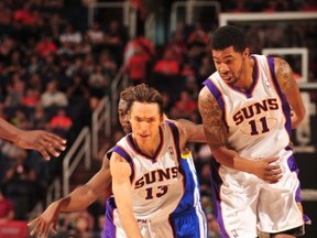 Phoenix Suns Steve Nash drives around the screen of teammate Markieff Morris against the Golden State Warriors in an NBA game played on January 2, 2012 at U.S. Airways Center in Phoenix, Arizona. (Barry Gossage/NBAE via Getty Images/AFP)