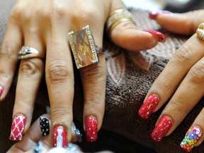A visitor has her nails decorated at a salon on the sidelines of the third day of Lakme Fashion Week Spring/Summer 2010 in Mumbai on September 20, 2009. (AFP PHOTO/Indranil MUKHERJEE)