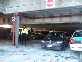 A 25-year-old man has died after suffering severe burns to most of his body at a Carleton University parking garage Tuesday afternoon. Officials believe the incident was self-inflicted. (LARISSA CAHUTE/OTTAWA SUN)