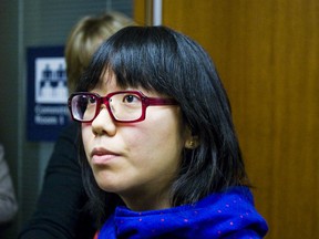 Karen Okamoto - whose father was killed by a sidewalk cyclist - went to Toronto City Hall on Wednesday demanding police crack down on bicyclists riding on the sidewalk. (ERNEST DOROSZUK/Toronto Sun)