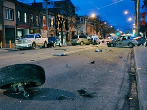 Vehicle parts are scattered across Queen St. E. near Ossington Ave. Thursday morning after a multi-vehicle collision. (David Ritchie photo)
