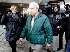 Ex-bishop Raymond Lahey is released on time served after being sentenced to 15 months in jail and two years probation, for importing child porn that included bondage photos of young boys wearing religious trappings, at the Ottawa Courthouse Wednesday, Jan. 4, 2011. (DARREN BROWN/Ottawa Sun)