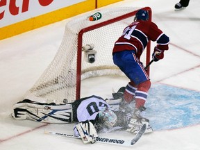 Canadiens' Lars Eller scores on a penalty shot against Chris Mason during the third period of Winnipeg's 7-3 loss Wednesday night. (CHRISTINNE MUSCHI/Reuters files)