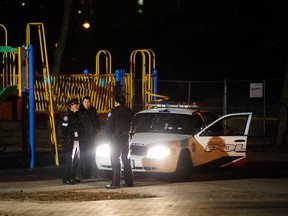 Toronto Police secure an apartment complex on Blevins Place, near Sumach and River Sts., late Thursday after a man was shot in the leg. (VICTOR BIRO photo)